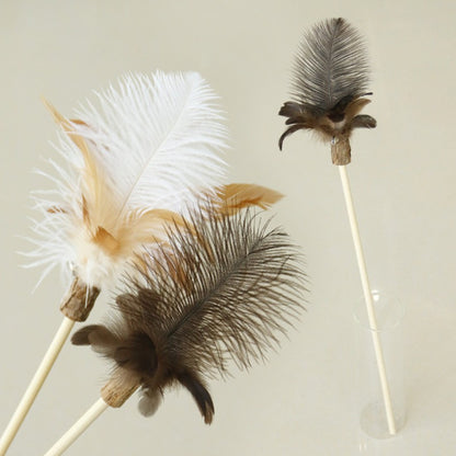 Moo Interactive Feather Wand Cat Toy with colorful feathers on a wooden stick