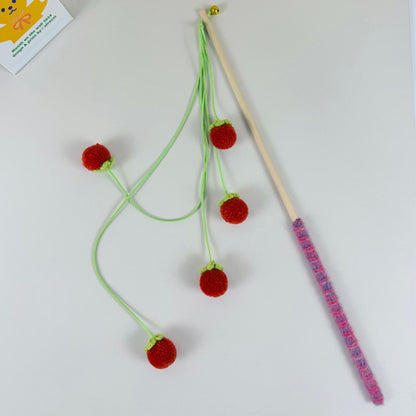 Moo Fruit Wand cat toy packaging with orange pom pom teaser visible