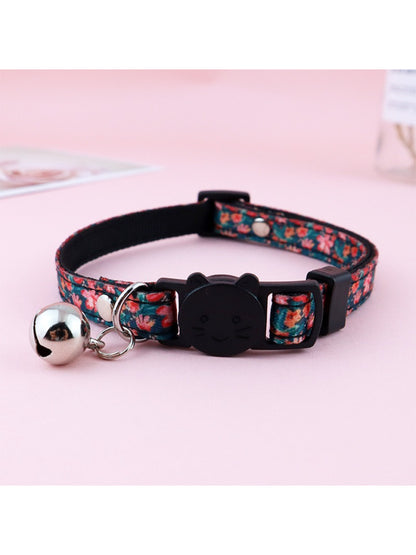 Side view of Mokka floral print bell cat collar highlighting bell and floral pattern
