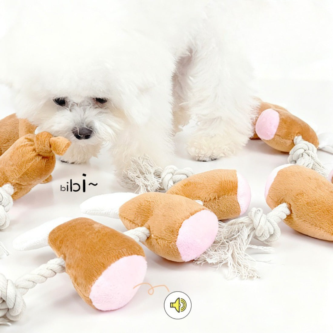 Petkin rope dog toy with attached chicken drumstick plush in red and beige colors