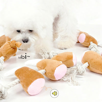 Petkin rope dog toy with attached chicken drumstick plush in red and beige colors