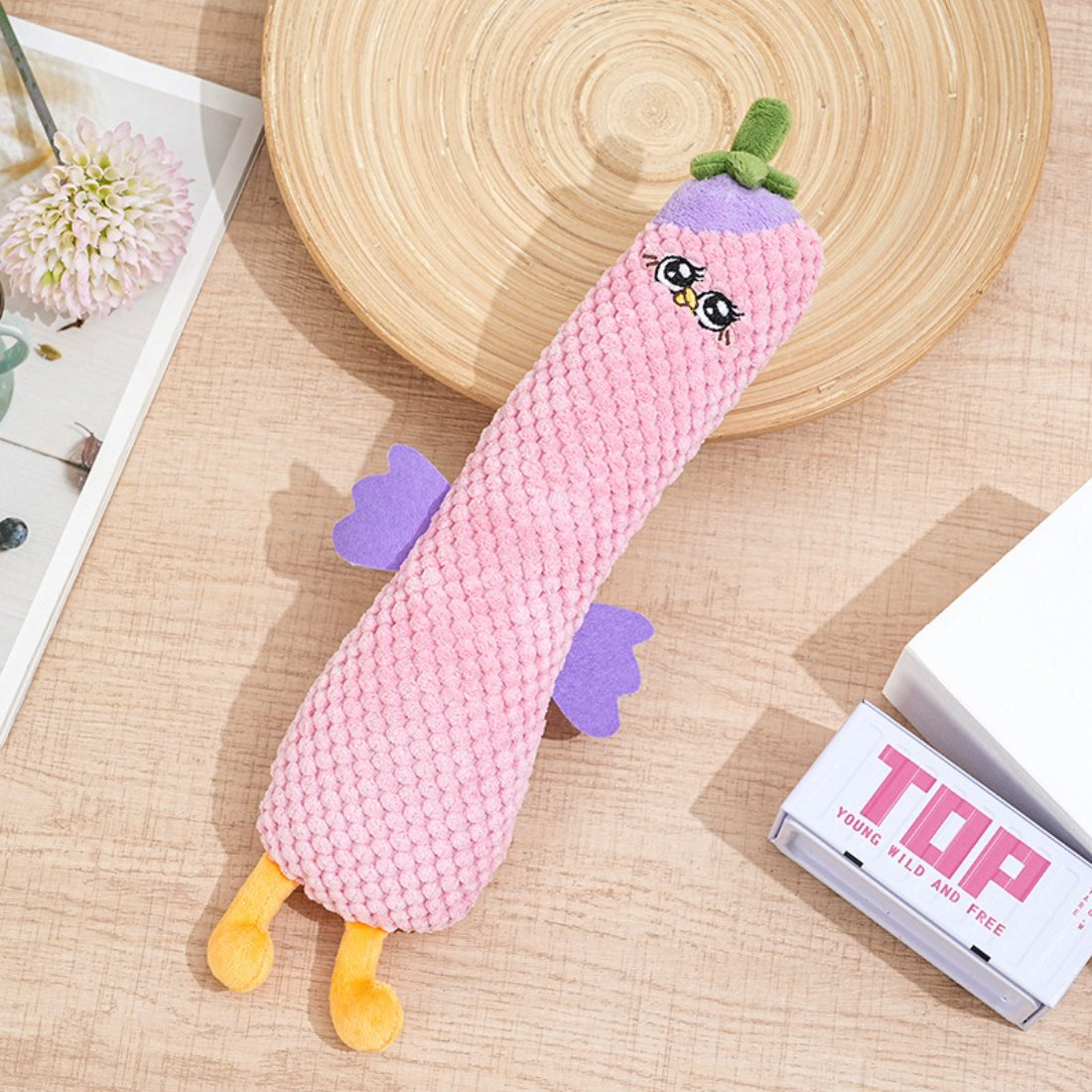 Petkin plush dog toy on a white background highlighting its colorful design
