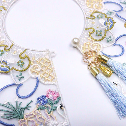 Mokka embroidered blossom collar worn on a white shirt showing collar design