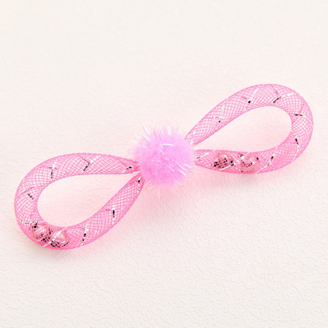 Moo cat toy featuring a round pom-pom attached to a mesh body on a plain background