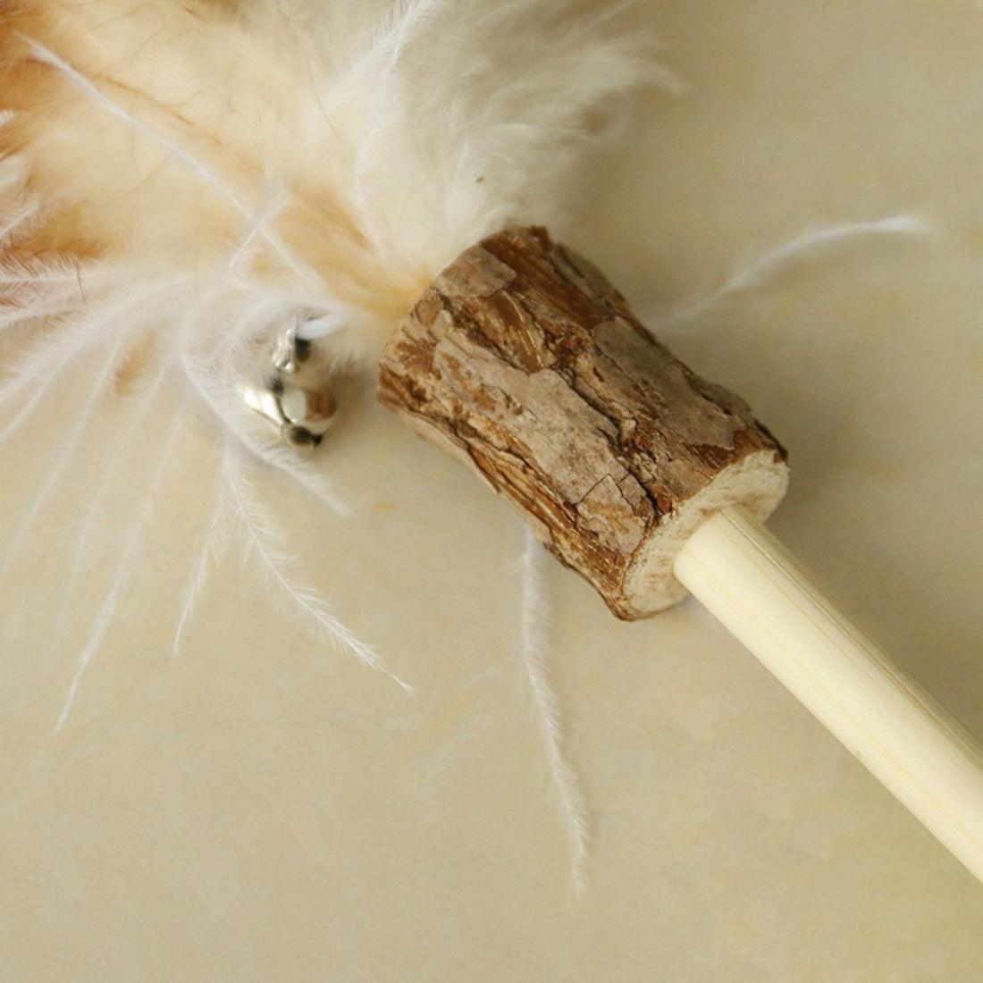 Close-up of the feather tip on the Moo Interactive Feather Wand Cat Toy