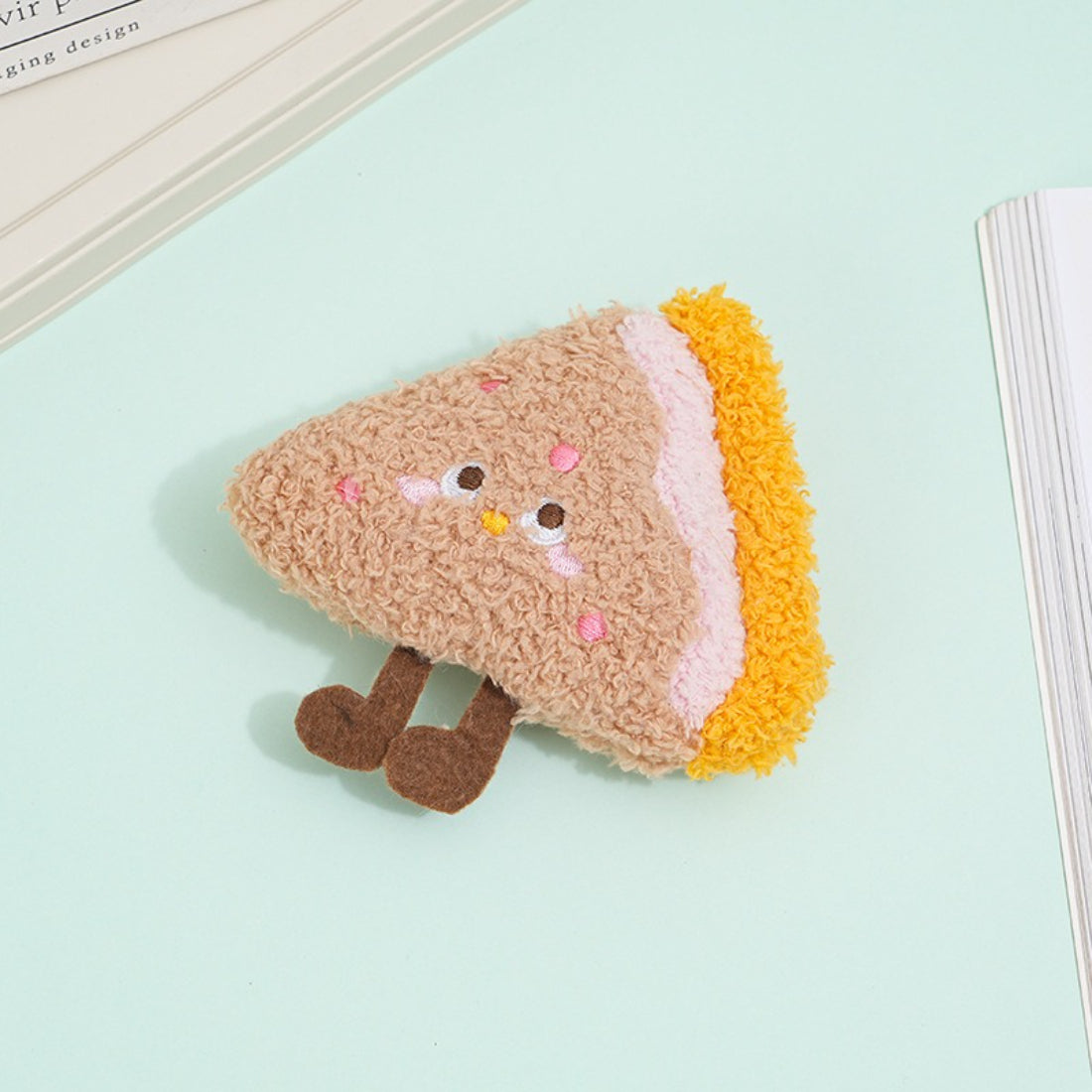 Side view of Moo food plush cat toy showing layered fabric and stuffing