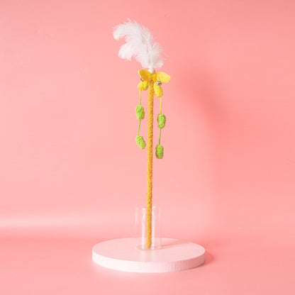 Cat playing with Moo Interactive Feather Wand featuring bright feathers