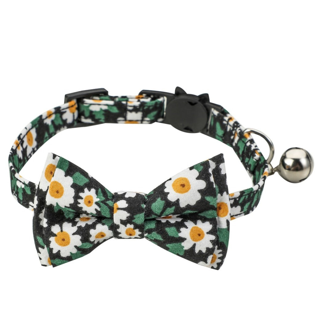 Mokka floral bowtie cat collar with pink and white flowers on a white background