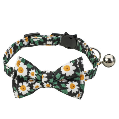 Mokka floral bowtie cat collar with pink and white flowers on a white background