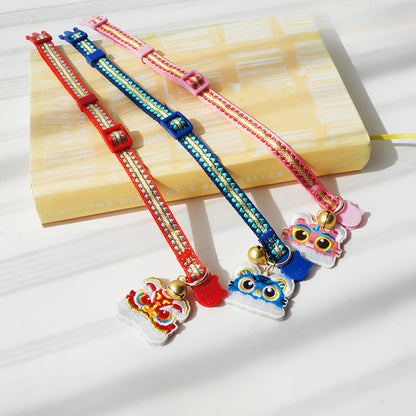 Mokka cat collar featuring a detailed tiger head charm on a dark band