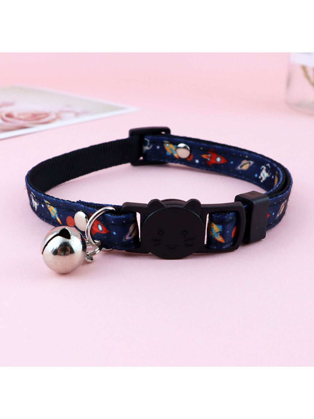 Cat wearing Mokka floral print bell collar with bell visible on neck