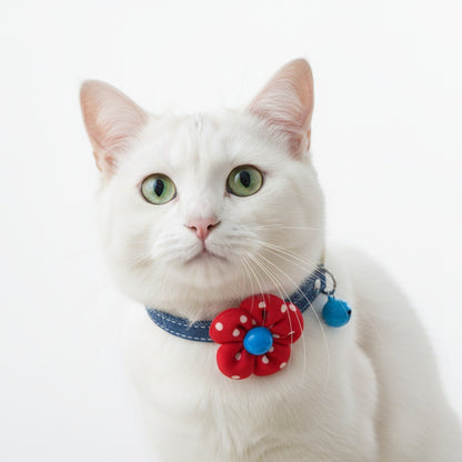 Mokka cat collar with polka dot bow and bell hanging on display hook