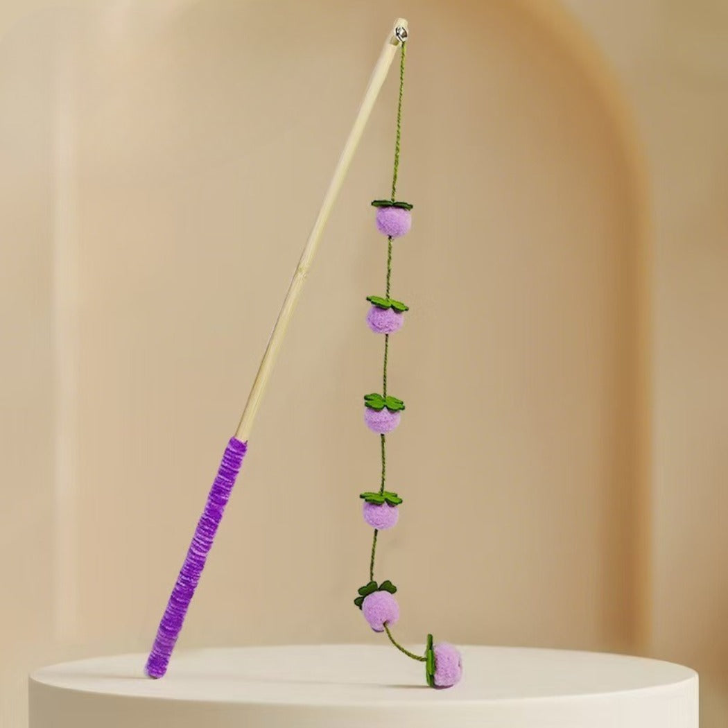 Cat playing with the Moo Garden Beads Wand Cat Toy