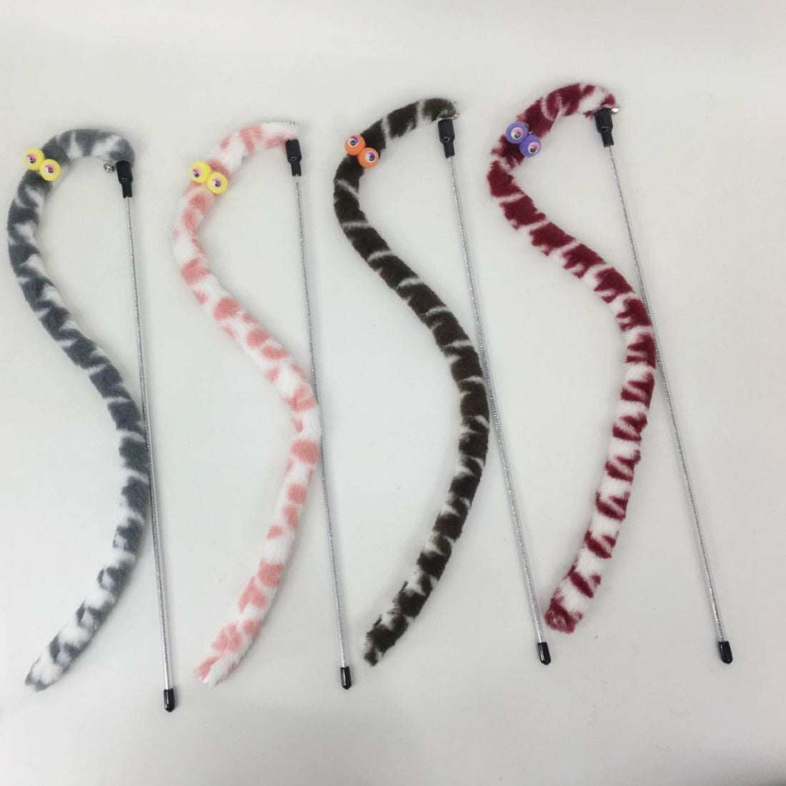 Moo Plush Worm Cat Teaser Wand showing the full length of the wooden stick and plush worm