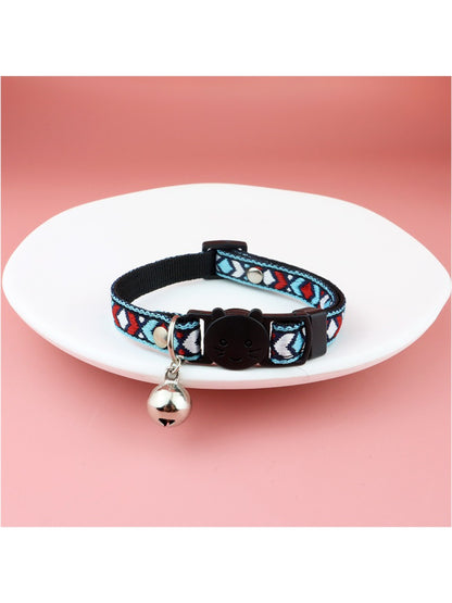 Mokka cat collar showing adjustable buckle and silver bell on brown diamond weave fabric
