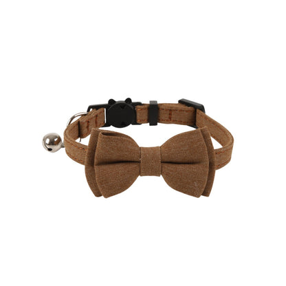 Mokka solid color bow cat collar with bell shown from side angle