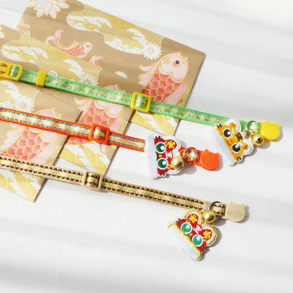 Mokka cat collar with tiger head charm shown coiled in a circle