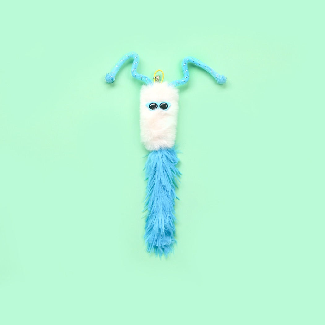 Close-up of Moo interactive fuzzy character toss cat toy showing texture and colors