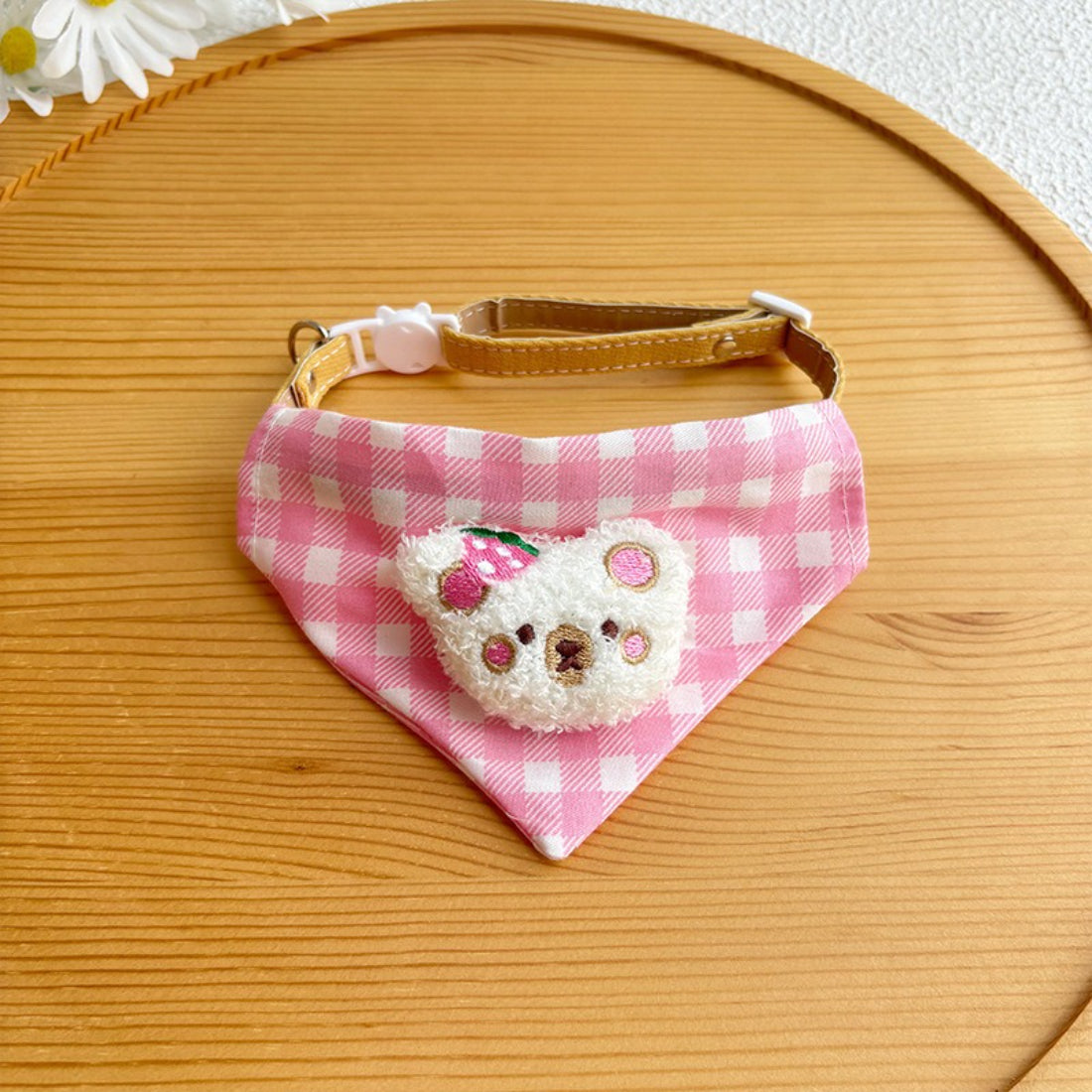 Cat bandana with pink gingham pattern folded neatly