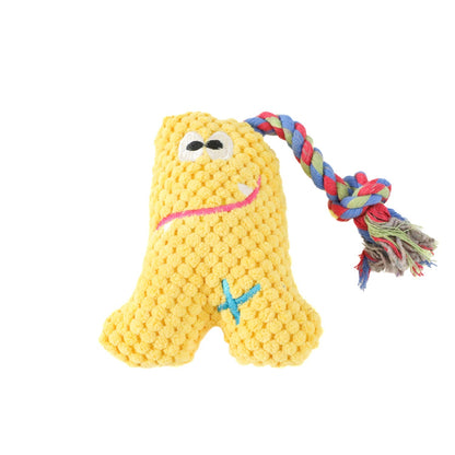 Petkin plush monster dog toy held in hand to show size and soft fabric details