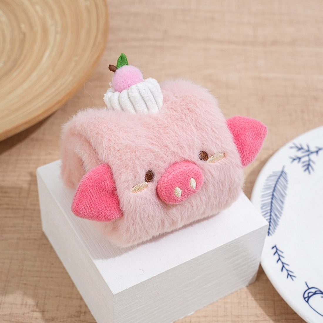 Petkin soft cube dog toy held in hand to show size and texture