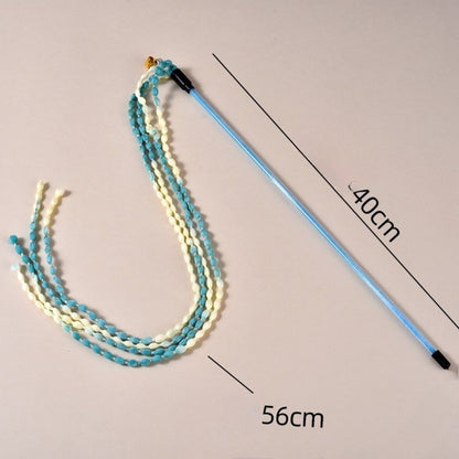 Moo cat teaser wand with braided cord handle and dangling teaser string on white background