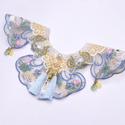 Close-up of Mokka embroidered blossom collar highlighting intricate flower stitching