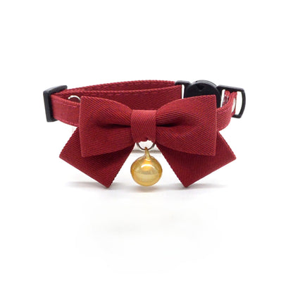 Close-up of Mokka cat collar bow and breakaway clasp detail