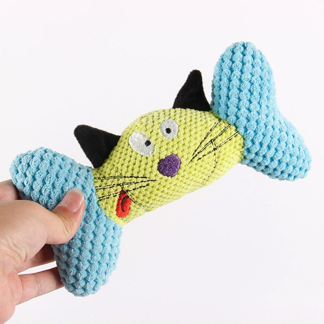 Close-up of colorful cat character plush toy showing detailed facial features