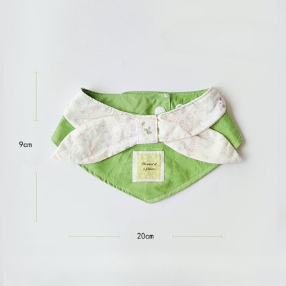 Soft green cat neck bib displayed flat showing full shape and size