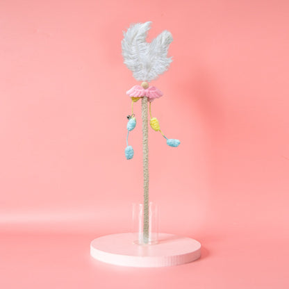 Moo Interactive Feather Wand held by hand with feathers fanned out