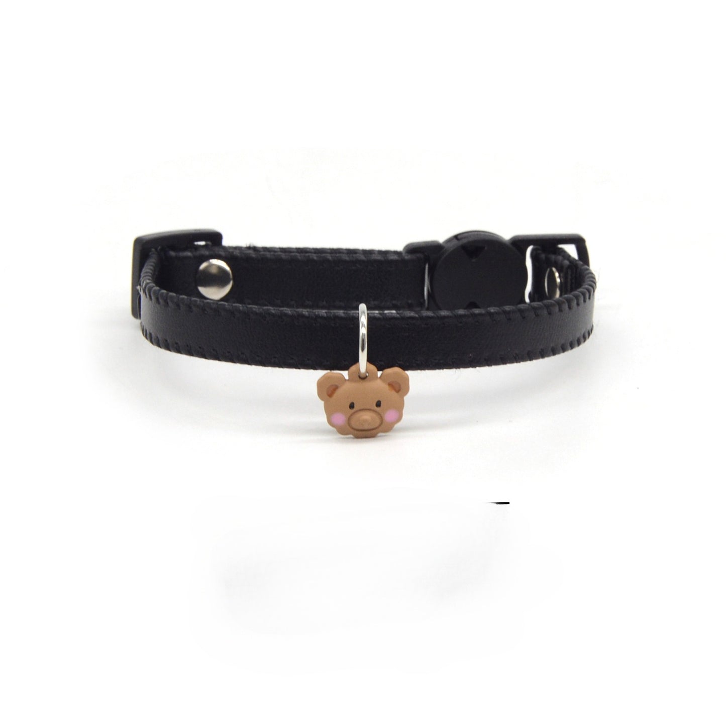 Brown leather breakaway cat collar with attached bear charm displayed flat