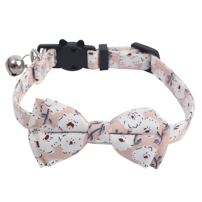 Mokka cat collar with floral bow tie and bell laid flat