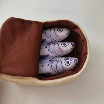 Moo Sardine Can Hide-and-Seek Cat Toy displayed from a side angle on white surface