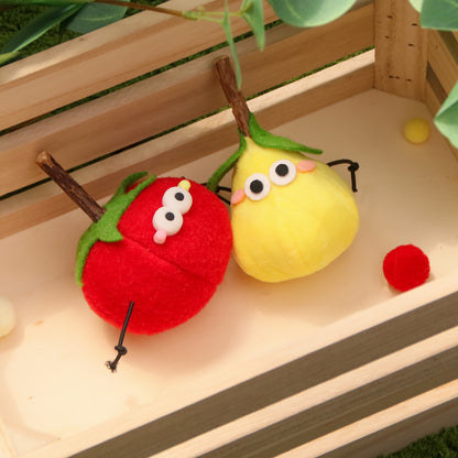 Moo cat toy in the shape of a purple grape cluster with a cute face