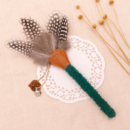 Feather cat toy from Moo set featuring bright feathers on a stick