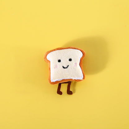 Bread cat toy resembling a round loaf with a cat face design