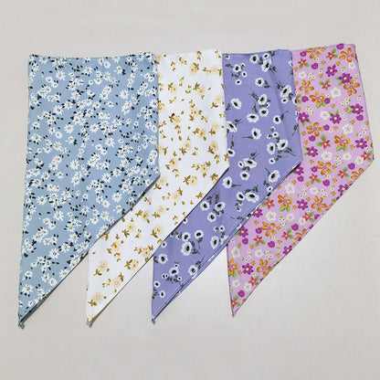 Furbud floral pet bandana laid out flat with visible tie-on ends