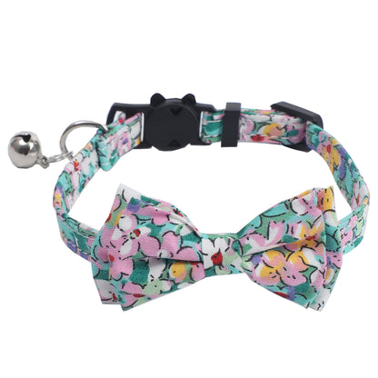 Close-up of Mokka floral bow tie cat collar showing bell detail