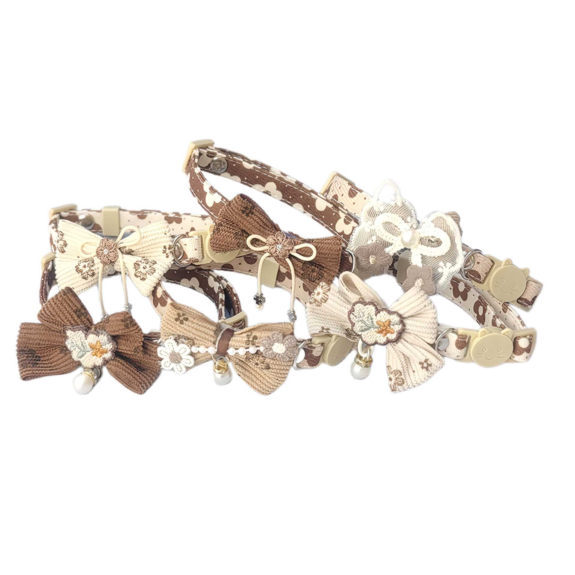 Mokka bow cat collar displayed flat showing adjustable strap and floral charm