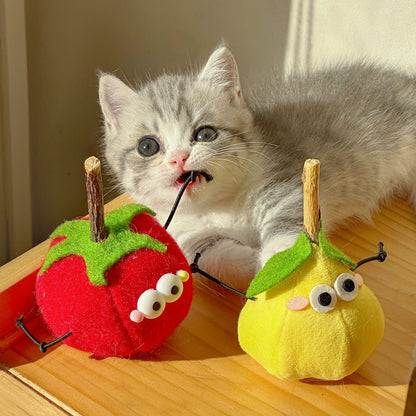 Moo cat toy shaped like a green apple with a happy face