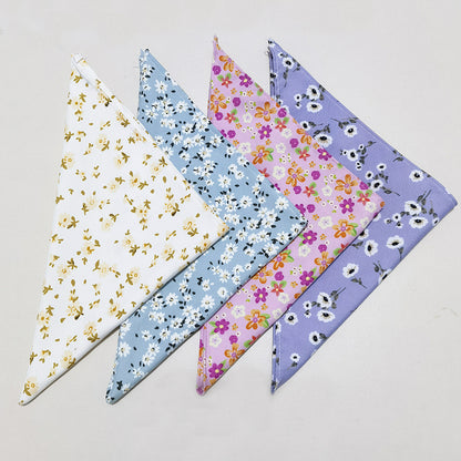 Furbud floral pet bandana featuring pink background with white floral print
