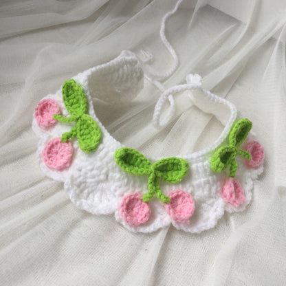Close-up of Mokka cherry knit adjustable cat collar showing knit texture and buckle