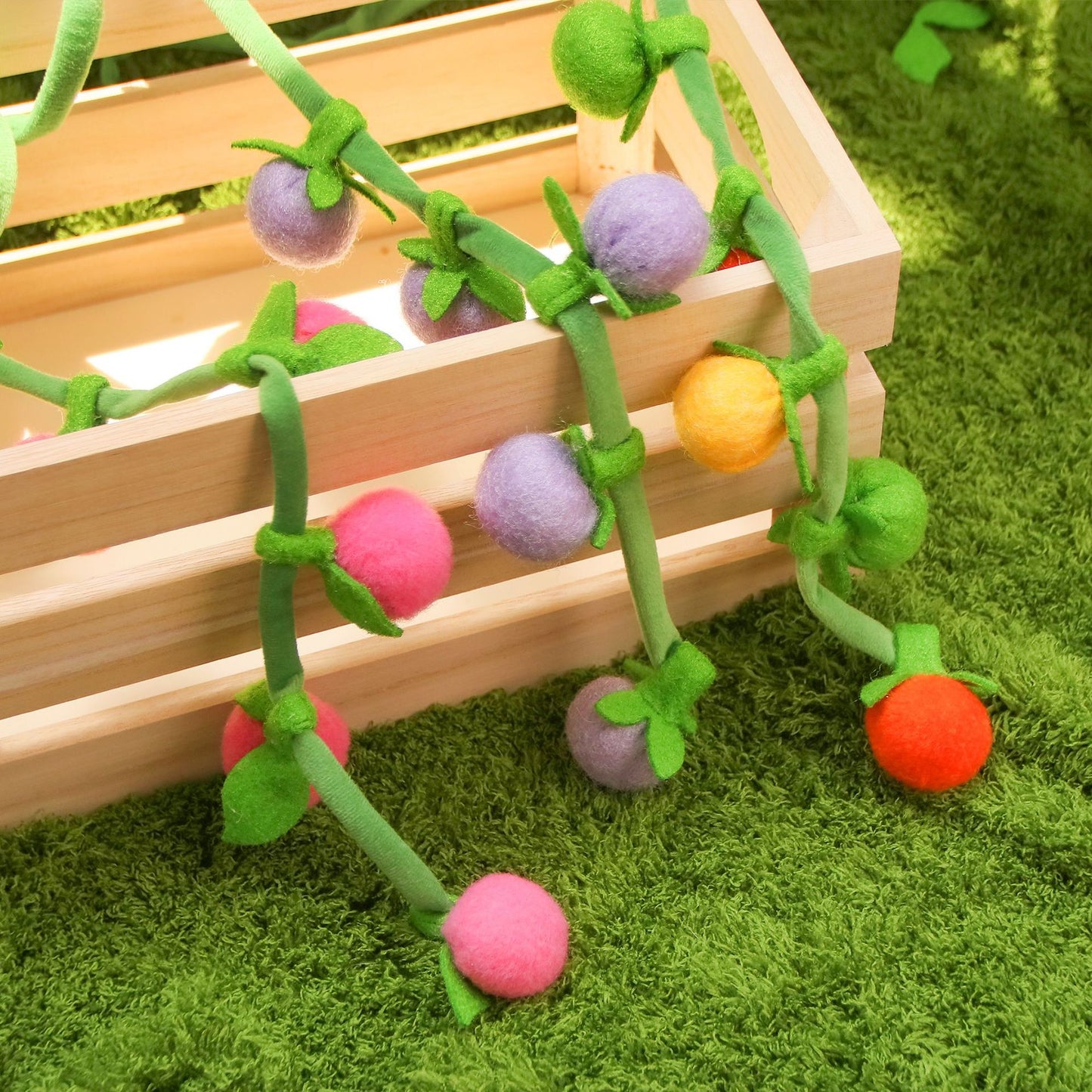 Moo hanging fruit vine cat toy shown from an angle emphasizing the hanging feature