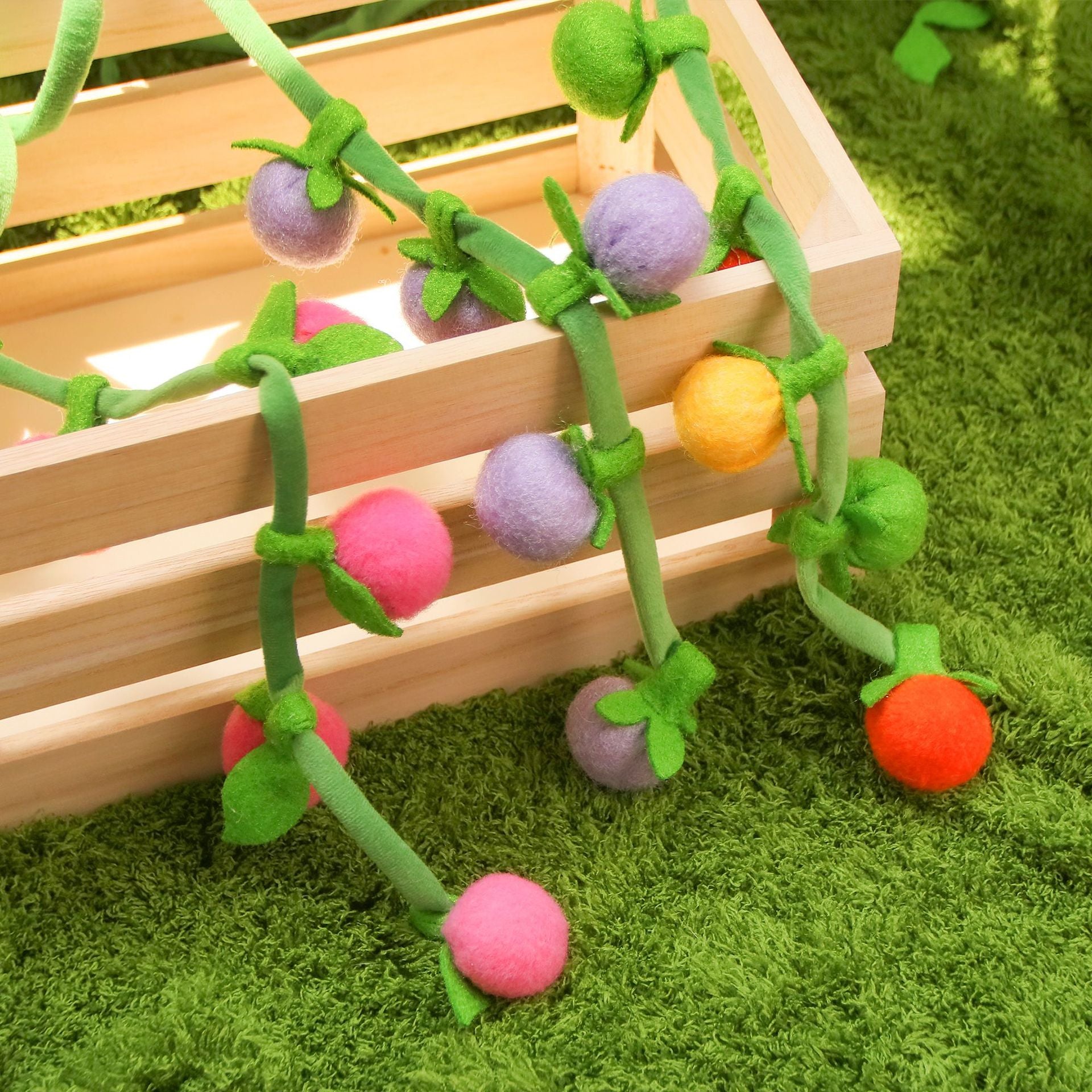 Moo hanging fruit vine cat toy shown from an angle emphasizing the hanging feature
