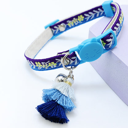 Mokka floral cat collar coiled to show flexibility and adjustable sizing