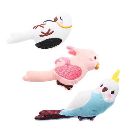 Set of three colorful bird-shaped cat toys from Moo with feathers and small bells