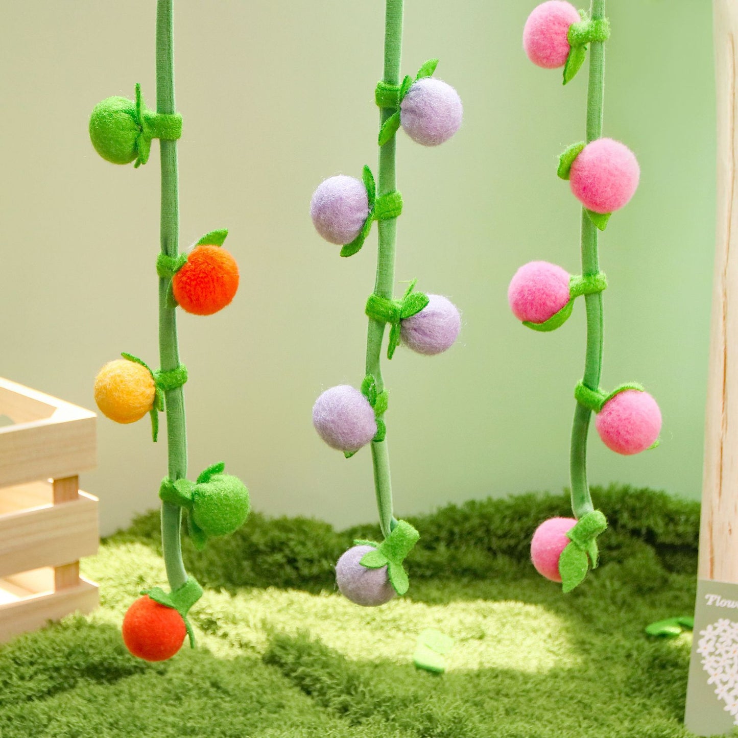 Moo hanging fruit vine cat toy with bright fruit shapes arranged along the vine