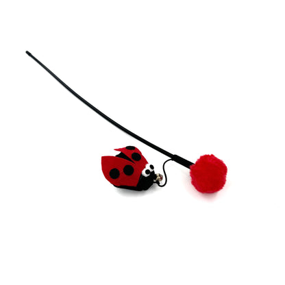 Moo Flower & Insect Cat Wand Toy with flower and insect attachments shown from above