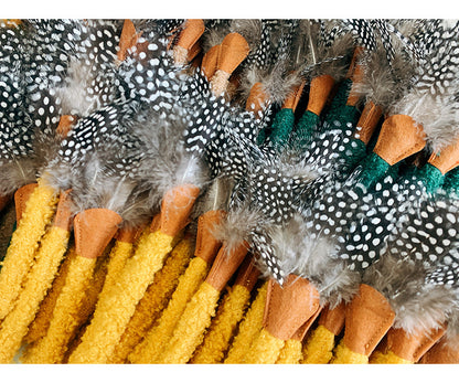 Set of three feather cat toys from Moo with assorted feather colors